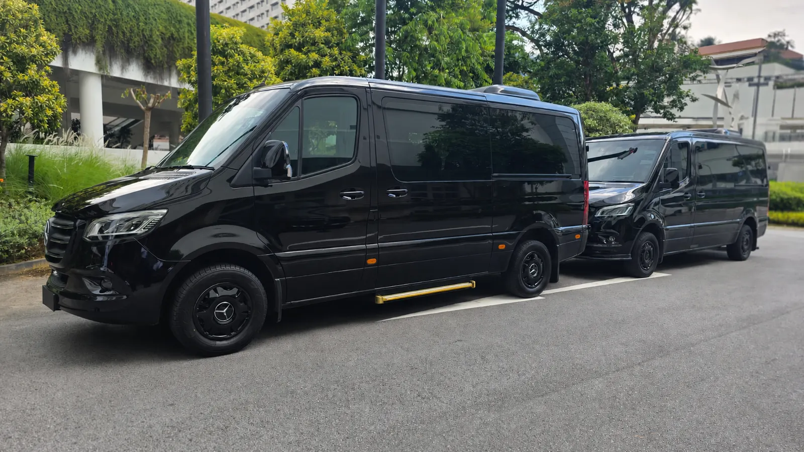Black executive vans and chauffeur vehicles for group transport in Singapore